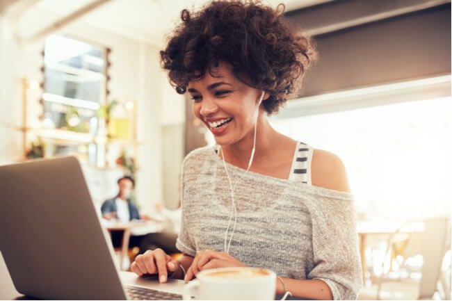 Woman works on her laptop looking for SEO consultants.